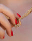 gold and red gemstone ring