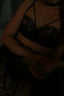 a woman in a bra top reading a book