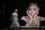 Woman walking past a large advertisement of a woman