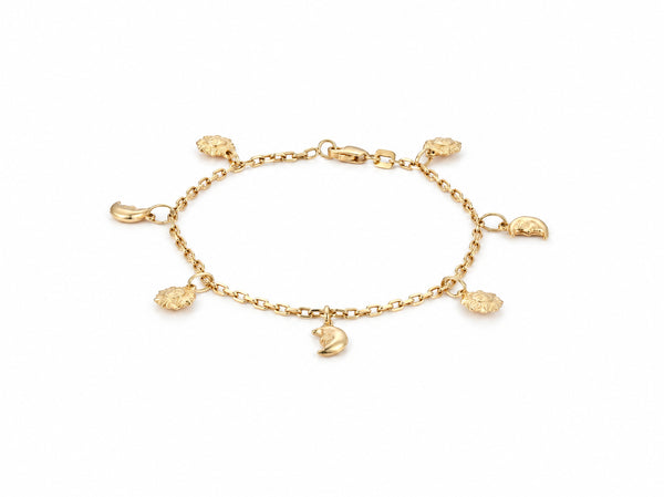 Gold charm bracelet shown full length with four sun charms and three crescent moon charms