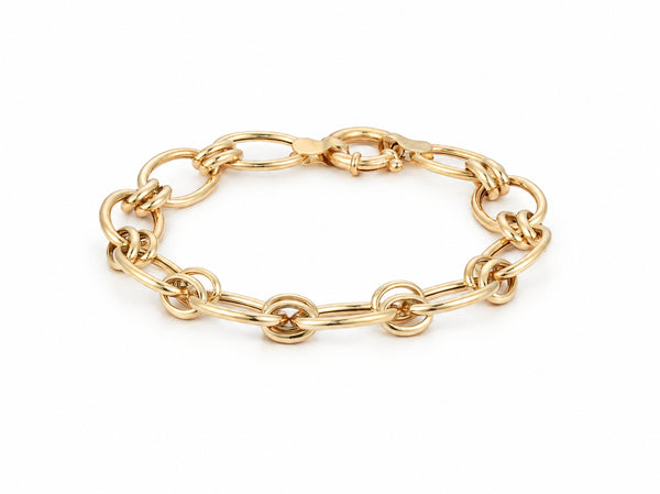 Gold bracelet shown full length with large oval links, round links and a toggle clasp