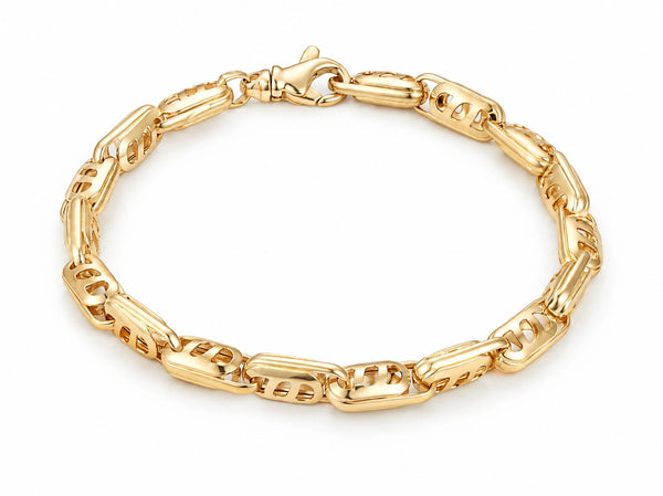 18K yellow gold bracelet with alternating solid bar and openwork links, laid flat on a white background