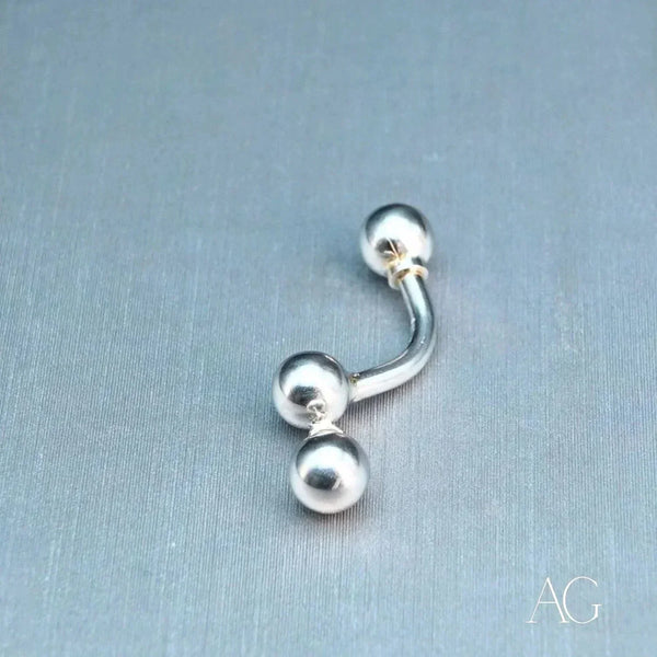18k white gold curved barbell with spherical ends, elegant art gold jewelry piercing