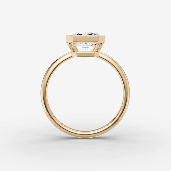 Yellow gold bezel engagement ring setting, side view showing band and stone depth
