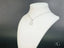 Silver-colored necklace with celestial star of David pendant in 18k white gold art jewelry