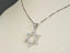 Silver chain necklace with celestial star pendant in 18k white gold and diamond accents