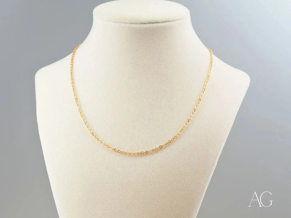 Front view of delicate 18K gold chain necklace showing full length drape