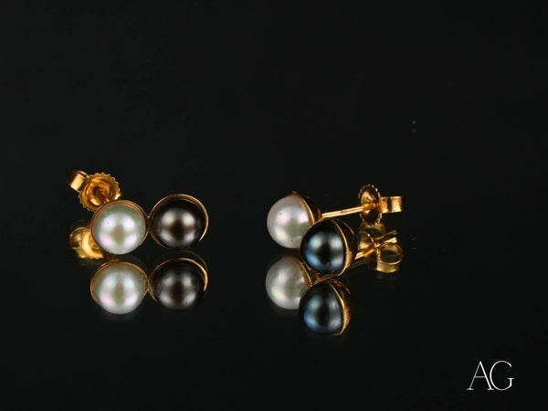 Eclipse Elegance 18K gold black and white pearl earrings