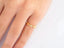 Elegant 18k yellow gold CZ heart ring with alternating plain and diamond-encrusted heart shapes on finger