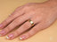 Woman’s hand with essence linea 6mm ring and French-tip manicure featuring art gold jewelry
