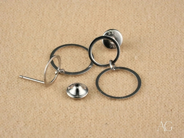 Disassembled components of Ethereal Circles 18K white gold dangle earrings