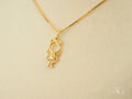 Golden Grace: Gold Doll Girl Pendant