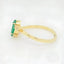 Luxurious Emerald Marquise Ring featuring an 18k gold band and rectangular emerald gemstone