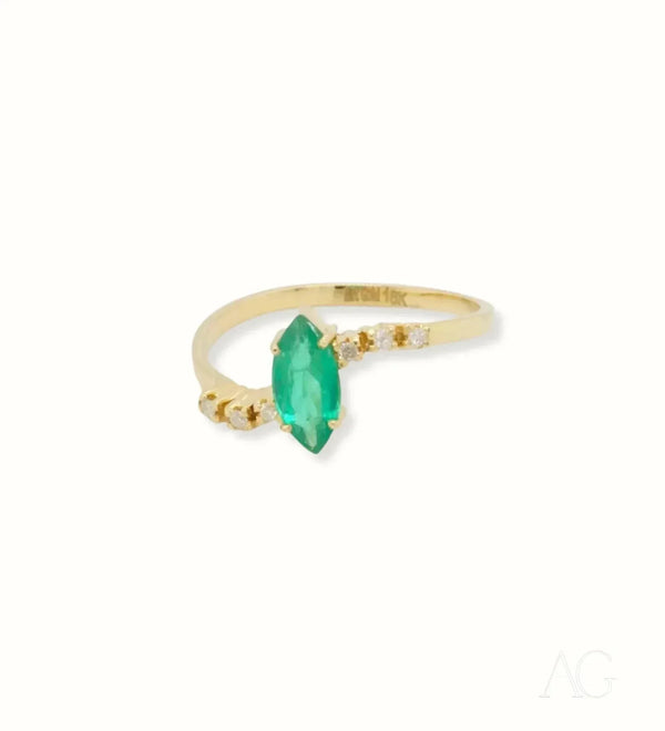 Luxurious 18k emerald marquise ring with diamond accents