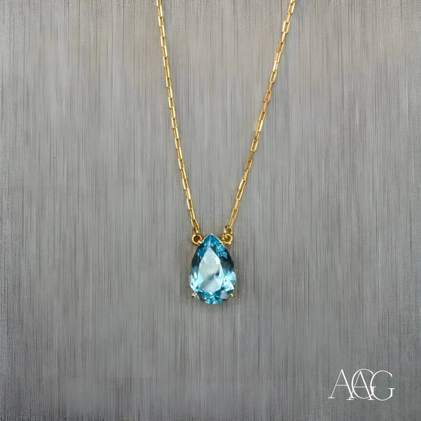 18 carat gold necklace with pear-shaped aquamarine pendant