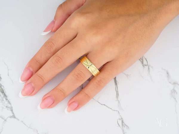Radiant Harmony wedding band with starburst engraving in art gold jewelry