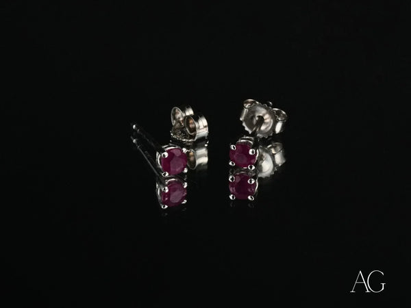 Scarlet Whispers white gold ruby stud earrings with red gems