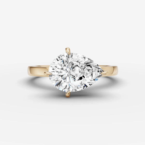 East-west pear solitaire ring setting in yellow gold with diamond band, top view