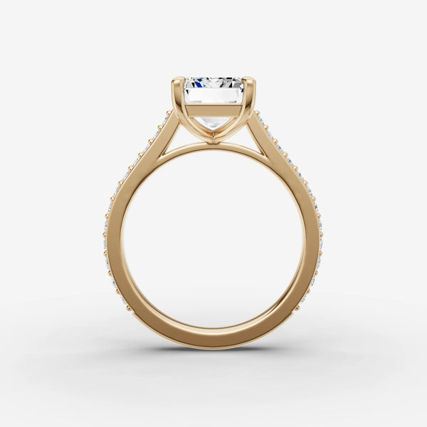 Side profile of cathedral ring setting showing arched shoulders and pave band in yellow gold