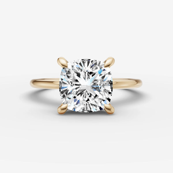 Yellow gold solitaire engagement ring setting with cushion-cut center stone, front view