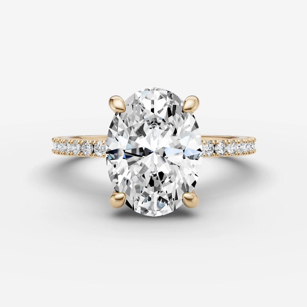 Oval engagement ring setting in yellow gold with pave band, front view