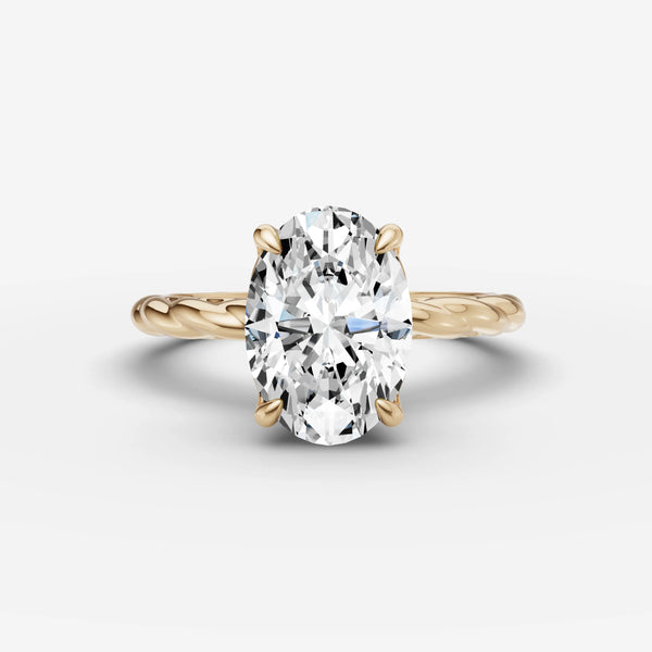 Oval engagement ring setting with twisted shank in yellow gold, front view