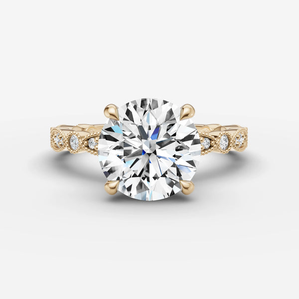 Front view of Heritage Round engagement ring setting in yellow gold with pave diamond band