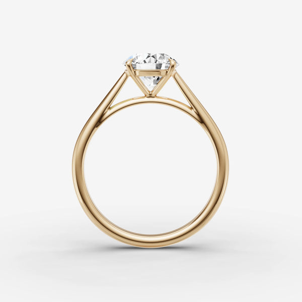 Cathedral engagement ring setting in yellow gold, side view showing cathedral arches