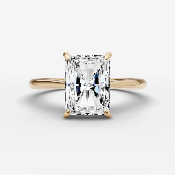 Radiant-cut solitaire engagement ring setting in yellow gold, front view