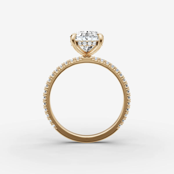 Yellow gold ring setting showing hidden halo under oval center stone, side view
