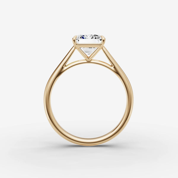 Cathedral engagement ring setting in yellow gold, side view showing arched shoulders