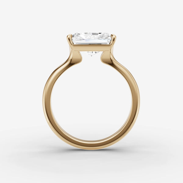 Yellow gold solitaire ring setting, side view showing prongs and band profile