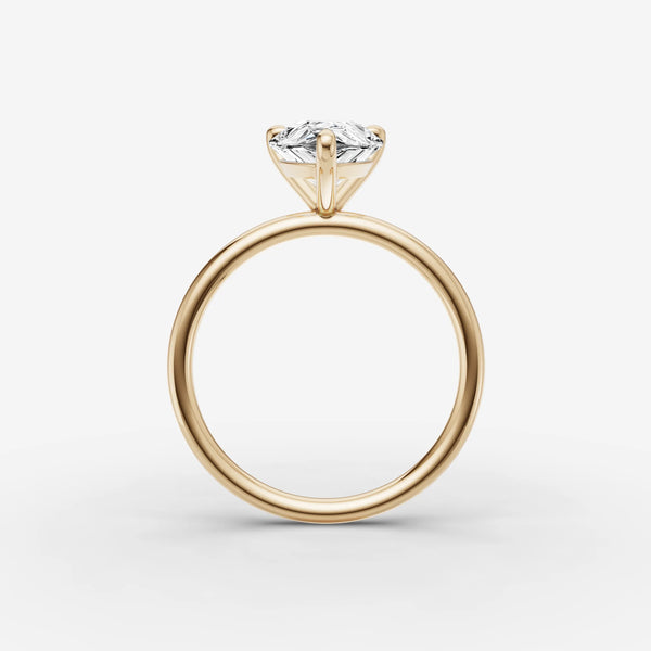 Solène Pear ring setting profile view, showing round side diamonds along the band