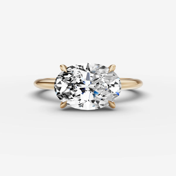 East-west oval solitaire engagement ring setting in yellow gold, front view showing four-prong center setting