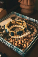 18k gold chain bracelet with lapis lazuli accents on pearl necklaces