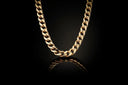 A gold chain on a black background