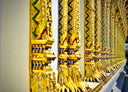 A long row of gold bracelets in a store