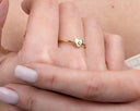 A close up of a person holding a ring
