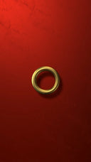 a gold ring sitting on a red surface