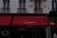 A building with a red awning on the front of it