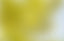 a blurry image of a yellow and blue sky