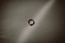 silver ring on gray textile