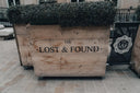 Rustic lost & found crate with art gold jewelry treasures