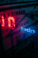 Red 00 digital display with jewelry neon sign and crown jewels theme