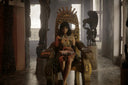 Golden ornate throne with intricate 18k gold jewelry carvings