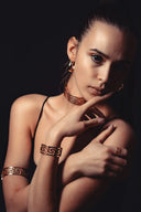 Gold-toned greek key pattern ancient jewelry set including choker bracelet ring and earrings inspired by royal treasures