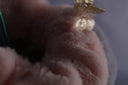 Fluffy pink faux fur with elegant art gold jewelry accessory