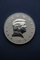 a close up of a coin with a president on it