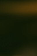 Dark abstract background with subtle warm light.