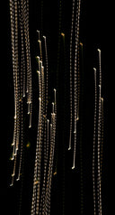 a bunch of lights that are on the side of a wall